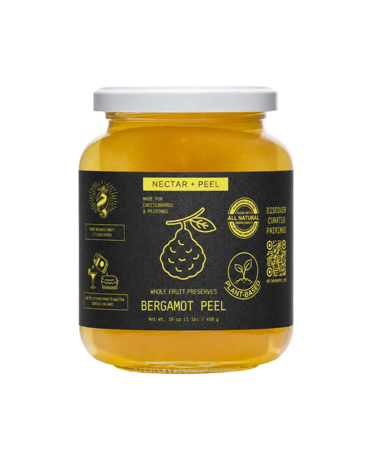Jar of bergamot peel preserve with a black label on a white background