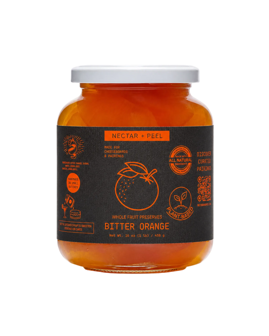 Jar of bitter orange preserve with a black label on a white background