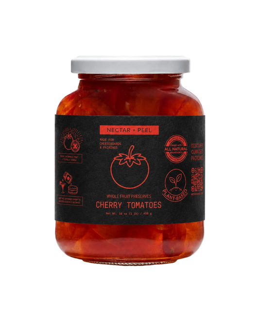 Jar of cherry tomatoes with a black label on a white background