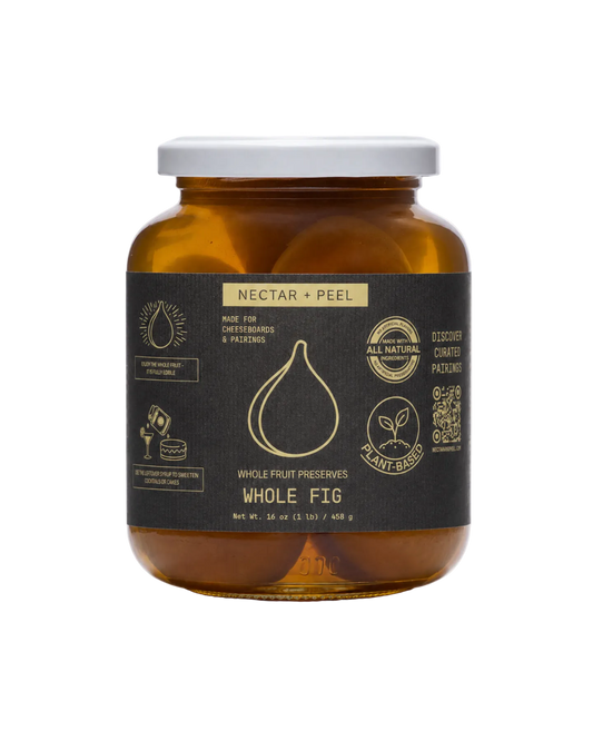 Whole Fig preserved in an Amber glass jar with a black label on a white background
