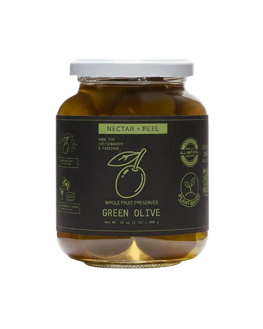 Jar of green olive preserves with a black label on a white background