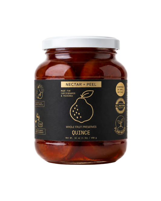 Jar of Nectar + Peel quince preserves on a white background